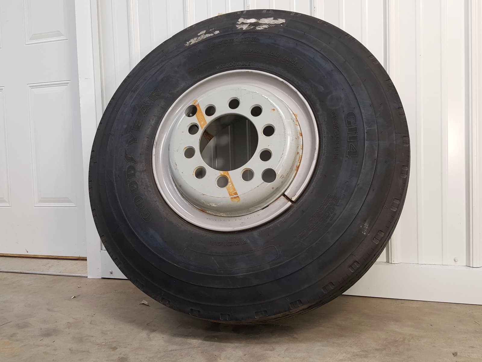 10.00 R15 TR Goodyear G114 Unisteel Tire w/ 100% Tread on Steel Budd Wheel-0